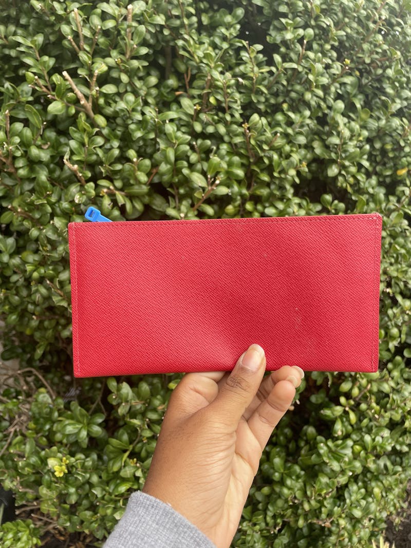 Slightly used Louis Vuitton wallet with the red on